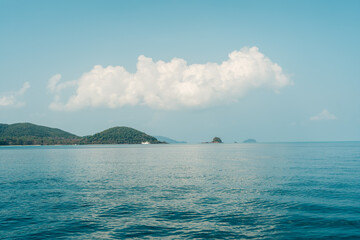 Seascape with Majestic Mountains, Tranquil Island, and Clear Blue Sky