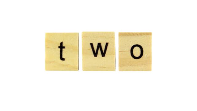 Short word english letter or text on a small wooden cubes block on white background with clipping path.Copy space concept and selection focus.
