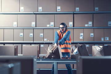 Aggressive rebellious worker smashing boxes at work