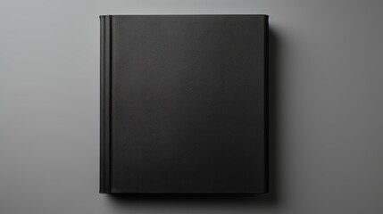 Black Book Cover on Gray Background.