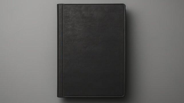 Black Book Cover on Gray Background.