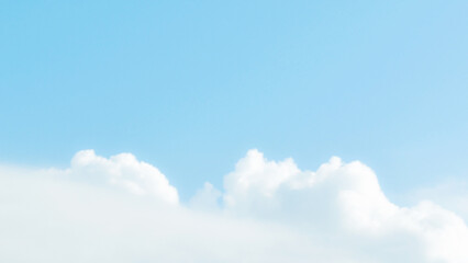Blue sky with cumulus white fluffy cloud. Soft blur pastel sky for background backdrop. Beautiful...