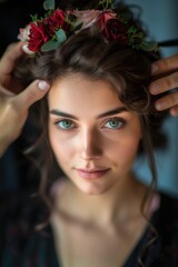 Naklejka premium A woman having her hair styled by a professional stylist. Suitable for beauty and fashion industry