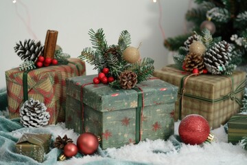 Fototapeta na wymiar Christmas presents piled on snowy ground, perfect for holiday season designs