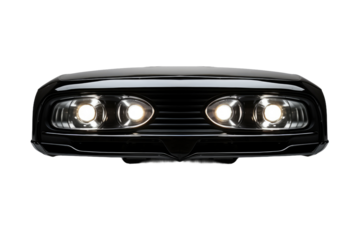 Close Up of Car Headlights. This close up shot showcases the powerful headlights of a car illuminating the surrounding area. The clean lines and reflective surfaces of the headlights.
