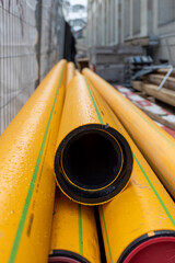 Construction site, yellow tubes in perspective  