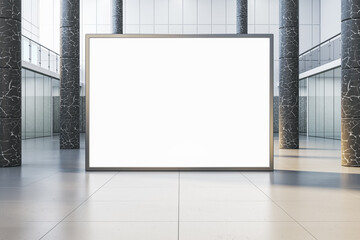 Modern empty white banner in interior with glass partitions, columns and concrete flooring. Mock...
