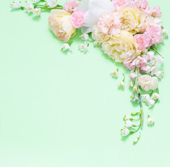 beautiful spring flowers on green background