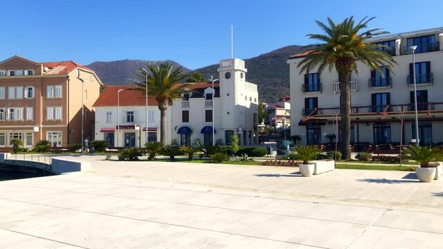 Buildings on a seaside promenade. Coastal town boulevard. Porto Montenegro, Tivat, Montenegro. Europe.