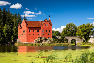 The Cervena (Red) Lhota Chateau is a beautiful and unique example of Renaissance architecture. It is located in the South Bohemian Region of the Czech Republic, surrounded by a picturesque lake. - 749837368