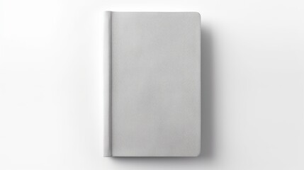 From a top view, a blank hardcover book with a light gray fabric cover is isolated on a white background, serving as a canvas cover book mockup.