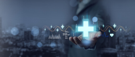 Businessman holds health icons health care digital connectivity Improving patient care health services technology