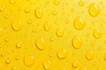 A yellow background with many small drops of water scattered across it