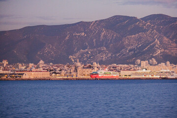 Fototapeta premium Passenger pax roro ferry cruiseship cruise ship liner in port of Marseille Provence, Cote d´Azur France with city skyline modern architecture