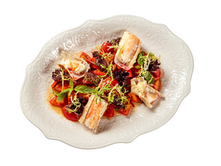 Delicious seafood crab salad on white plate on restaurant table background. Plate with healthy salad made with crab, tomatoes and fresh greens, decorated basil. Top view or flat lay