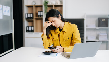 woman work late from home in room at late night overtime.Businesswoman bending over workplace in...