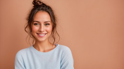 Fototapeta premium Subtle smile adorns woman's face against gentle orange hues 