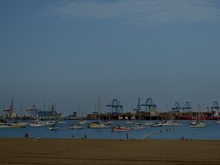 Moored boats at the Alcaravaneras beach during a summer day in Las Palmas de Gran Canaria, Spain