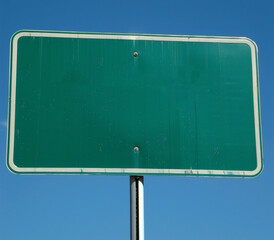 blank green sign with pole, blue sky - obrazy, fototapety, plakaty