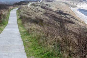 Glasbilder Nordsee, Niederlande wide path high above the dunes on the north sea Zeeland Netherlands