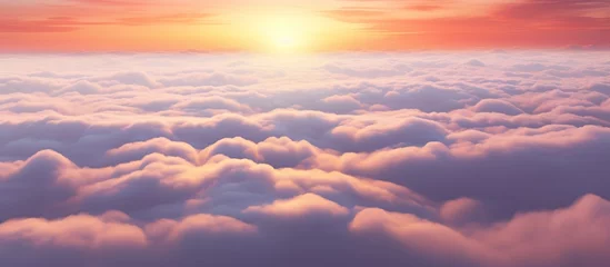 Fotobehang Aerial view of yellow sunset over white puffy clouds © danang