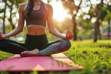 Abwaschbare Fototapete Calm unrecognizable sporty Caucasian female lady girl woman fitness sportswear meditating lotus position zen gesture outside nature forest park. Yoga exercises meditation sport lifestyle mental health © Yuliia