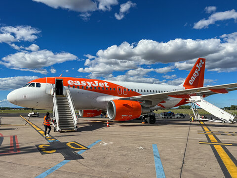 The airplane of easyjet airlines staying at Montpellier Airport. EasyJet plc, styled as easyJet, is a British multinational low-cost airline group.