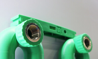 Close-up green pvc sanitary pipe joint.