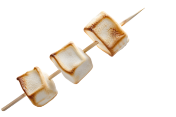 marshmallow skewers floating, emphasizing the golden brown roasting effect.