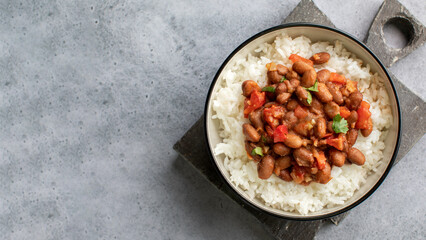 Vegan bean curry with rice and tomatoes. Indian cuisine. Vegetarian dish. 