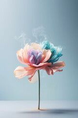 Pastel flower concept with colorful petals and white smoke against pastel blue background with copy space. Minimal blooming aesthetic.