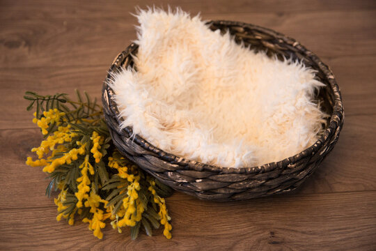 Basket with a background for a photo session of a baby.Basket for a newborn.