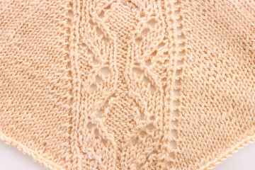 background of beige crochet ornament made of wool