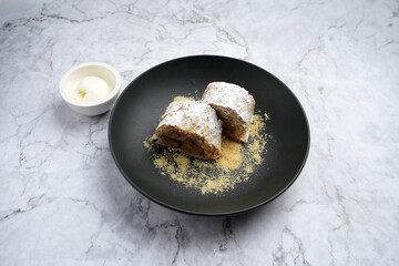 Sweet apple strudel with vanilla ice cream