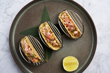 Shrimps tacos with salsa, vegetables and avocado