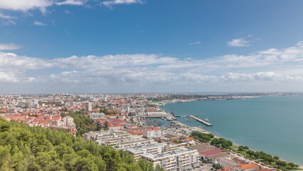 Panorama showing aerial view of marina and city center timelapse in Setubal, Portugal.
