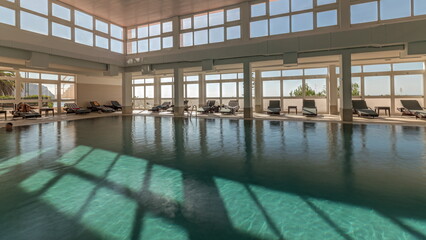 Panorama showing luxury indoor swimming pool, part of hotel timelapse