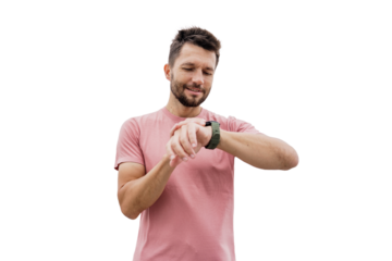A male runner uses a fitness watch on his arm, an isolated transparent background.