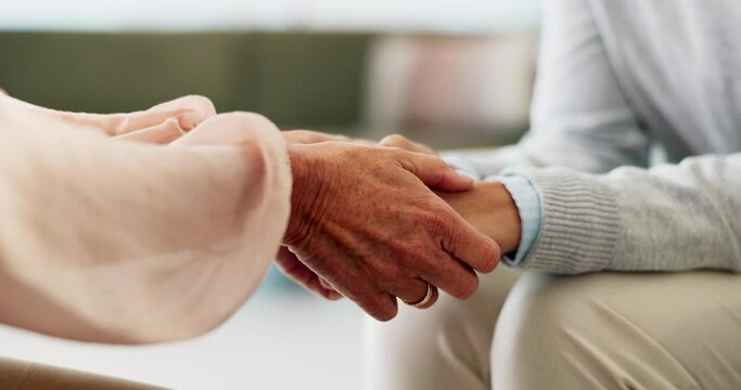 Patient, psychologist and holding hands for anxiety support or mental health comfort for therapy, depression or care. People, fingers and grief counseling service for trauma discussion, exam or fear