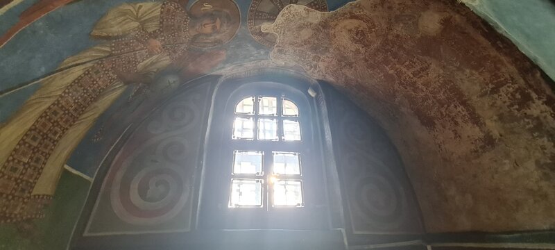 Ukrainian famous church of XII century. Cyril medieval church - today a museum. Scenic light in the dark. Heritage ancient and modern fresque on the walls.