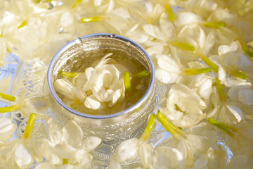 Water with jasmine in bowl. Thai tradition, Songkran festival concept