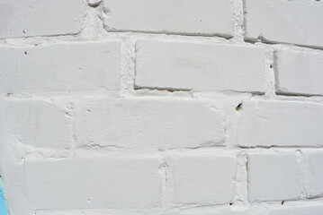 White brick building masonry painted white and light