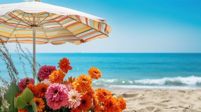 Flowers and umbrella on the beach with blue sky