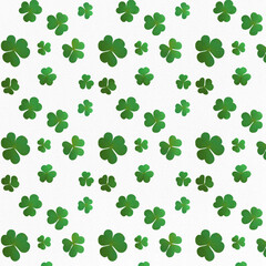 Fototapeta premium The seamless pattern of green clovers on a white background