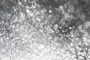 Abstract glare background. Tangled wire close-up. Blurred texture. Macro image. Selective focus