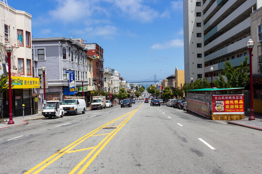 San Francisco, California, USA, June 29, 2022: Broadway with the Bay Bridge in the background. Broadway is an east–west street that runs from The Embarcadero to the Pacific Heights neighborhood.