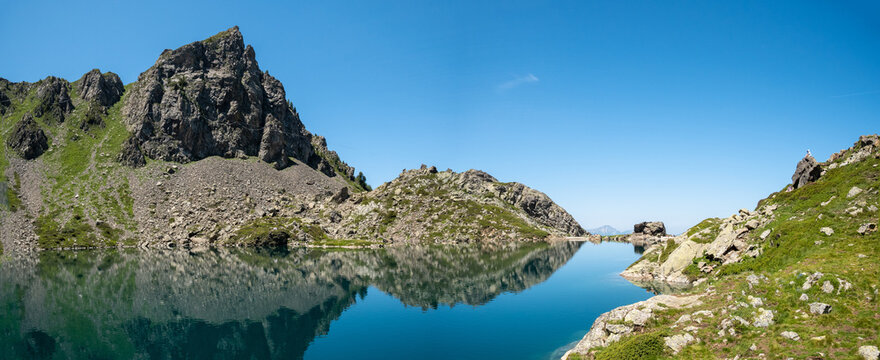 Water reflection at Crozet Lake in Belledonne Mountain during summer, french Alps, close to Grenoble, Is&egrave;re