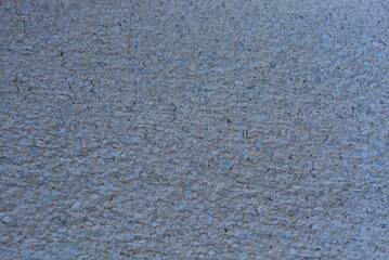 Old cement with a matte gray glass crumb in the shade