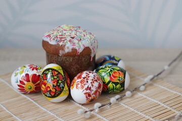 Easter, brightly colored Easter eggs and Easter cake. Celebration traditions