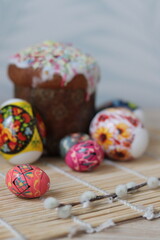 Easter, brightly colored Easter eggs and Easter cake. Celebration traditions